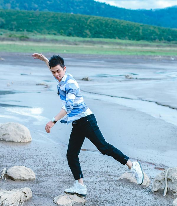 A serene landscape with a person standing peacefully, symbolizing balance.